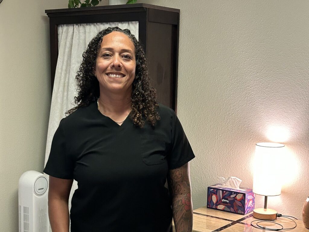 Keisha Harmon, massage therapist, in the massage room at Martinez Chiropractic