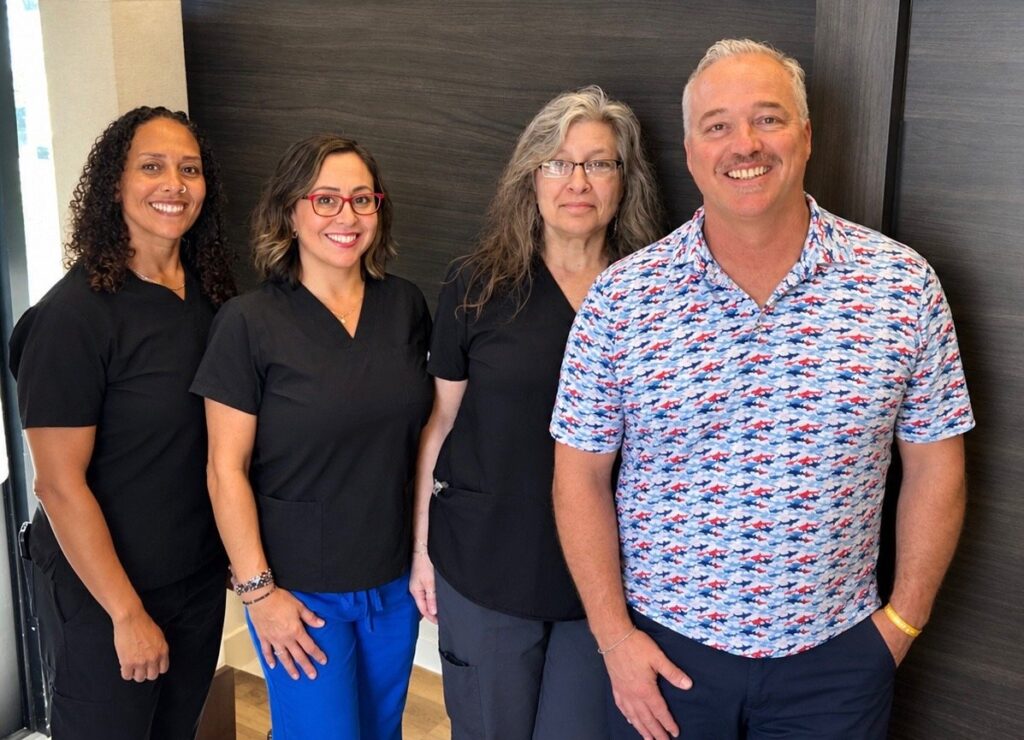 Keisha, Michelle, Kim and Dr. Fred Dietzen in the office